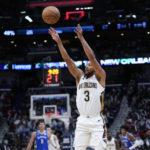 
              New Orleans Pelicans guard CJ McCollum (3) shoots a 3-point shot in the second half of an NBA basketball game against the Milwaukee Bucks in New Orleans, Monday, Dec. 19, 2022. The Bucks won 128-119. (AP Photo/Gerald Herbert)
            