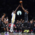 
              Golden State Warriors' Draymond Green (23) defends a three-point shot by Brooklyn Nets' Kevin Durant (7) during the first half of an NBA basketball game Wednesday, Dec. 21, 2022 in New York. (AP Photo/Frank Franklin II)
            