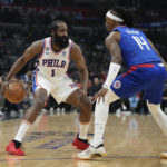 
              Los Angeles Clippers guard Terance Mann (14) defends against Philadelphia 76ers guard James Harden (1) during the first half of an NBA basketball game in Los Angeles, Tuesday, Jan. 17, 2023. (AP Photo/Ashley Landis)
            