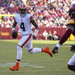 
              Cleveland Browns quarterback Deshaun Watson (4) scrambles out of the pocket during the first half of an NFL football game against the Washington Commanders, Sunday, Jan. 1, 2023, in Landover, Md. (AP Photo/Patrick Semansky)
            