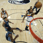 
              Minnesota Timberwolves guard D'Angelo Russell (0) goes up for a shot during the first half of an NBA basketball game against the Memphis Grizzlies, Friday, Jan. 27, 2023, in Minneapolis. (AP Photo/Abbie Parr)
            