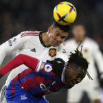 
              Manchester United's Casemiro and Crystal Palace's Wilfried Zaha, right, battle for the ball during the Premier League match between Crystal Palace and Manchester United at Selhurst Park in London, Wednesday Jan. 18, 2023. (Adam Davy/PA via AP)
            