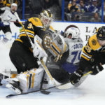 
              Tampa Bay Lightning center Ross Colton (79) crashes into Boston Bruins goaltender Linus Ullmark (35) after a scheme by defenseman Brandon Carlo (25) during the second period of an NHL hockey game Thursday, Jan. 26, 2023, in Tampa, Fla. (AP Photo/Chris O'Meara)
            