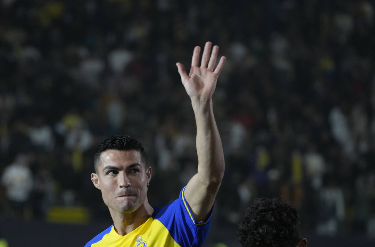 Cristiano Ronaldo greets Saudi fans during his official unveiling as a new member of Al Nassr socce...