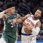 
              New York Knicks guard Jalen Brunson (11) is fouled by Detroit Pistons guard Killian Hayes (7) during the second half of an NBA basketball game, Sunday, Jan. 15, 2023, in Detroit. (AP Photo/Carlos Osorio)
            