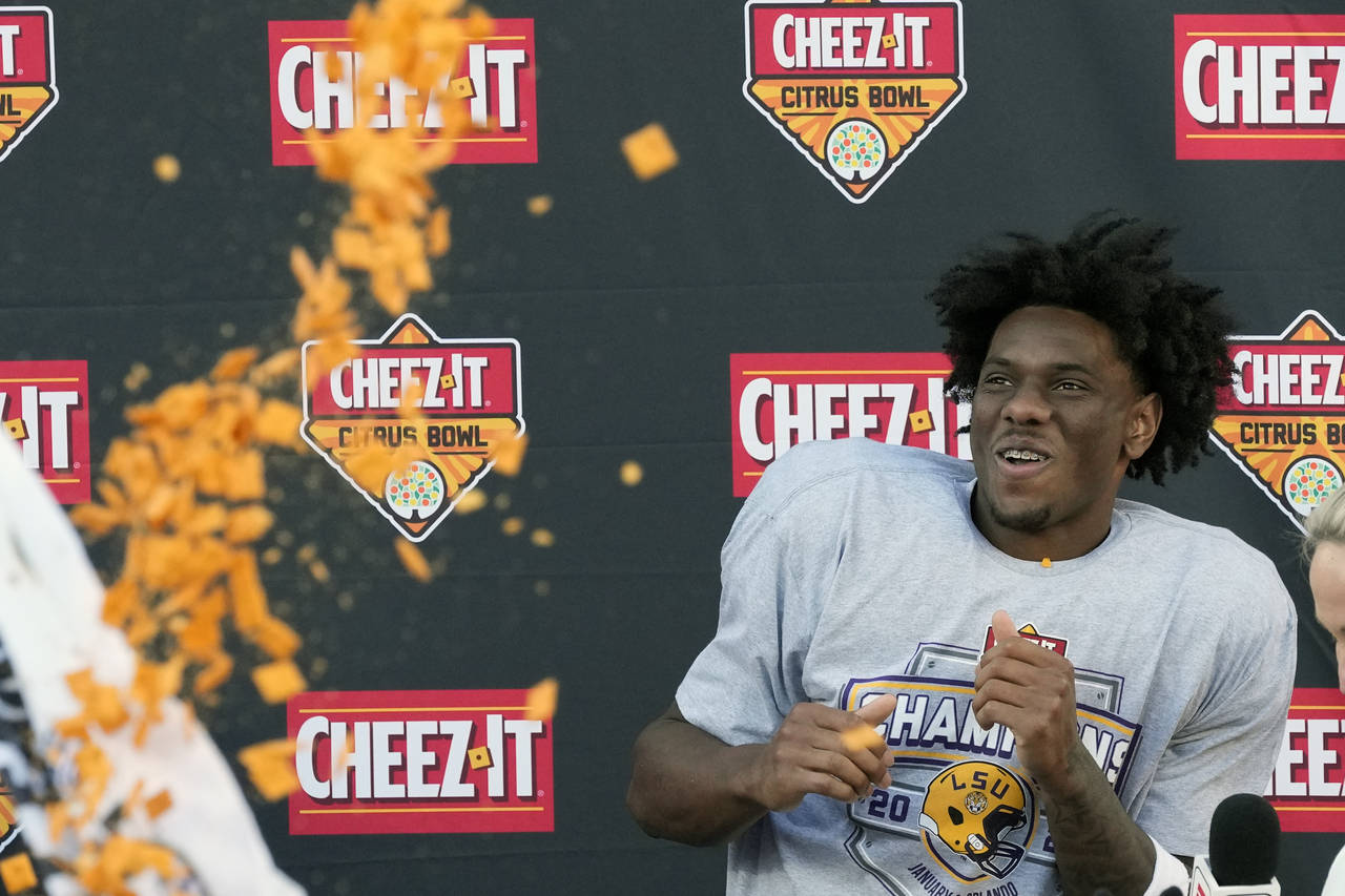 Teammates shower LSU wide receiver Malik Nabers with crackers after he was named MVP of the Citrus ...