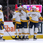 
              Nashville Predators center Thomas Novak, second from left, is congratulated by teammates after he scored against the Washington Capitals during the first period of an NHL hockey game Friday, Jan. 6, 2023, in Washington. (AP Photo/Jess Rapfogel)
            