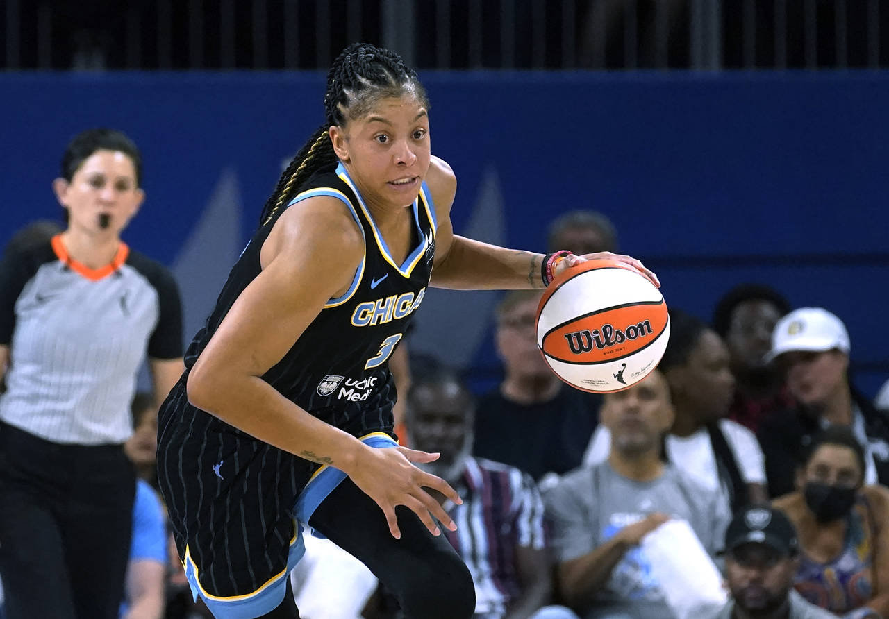 FILE - Chicago Sky's Candace Parker starts a fast break during Game 1 of the team's WNBA basketball...