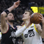 
              Los Angeles Clippers center Ivica Zubac (40) defends against Utah Jazz forward Lauri Markkanen (23) during the first half of an NBA basketball game Wednesday, Jan. 18, 2023, in Salt Lake City. (AP Photo/Rick Bowmer)
            