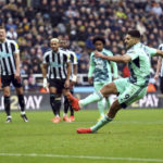 
              Fulham's Aleksandar Mitrovic scores his side's first goal of the game from a penalty kick before being ruled out for touching the ball twice, during the English Premier League soccer match between Newcastle United and Fulham, at St. James' Park, Newcastle, England, Sunday Jan. 15, 2023. (Owen Humphreys/PA via AP)
            