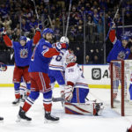 
              Montreal Canadiens goaltender Sam Montembeault (35) reacts after New York Rangers left wing Artemi Panarin (not shown) scored a goal in the second period of an NHL hockey game Sunday, Jan. 15, 2023, in New York. (AP Photo/Adam Hunger)
            