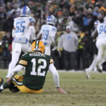 
              Green Bay Packers quarterback Aaron Rodgers sits on the turf after throwing an interception during the second half of an NFL football game against the Detroit Lions Sunday, Jan. 8, 2023, in Green Bay, Wis. (AP Photo/Morry Gash)
            