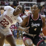 
              Nebraska's Sam Haiby (4) goes to the basket against Indiana's Chloe Moore-McNeil (22) during the first half of an NCAA college basketball game, Sunday, Jan. 1, 2023, in Bloomington, Ind. (AP Photo/Darron Cummings)
            