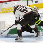 
              Dallas Stars goaltender Jake Oettinger (29) blocks a shot on goal against Arizona Coyotes left wing Michael Carcone (53) during the second period of an NHL hockey game in Dallas, Saturday, Jan. 21, 2023. (AP Photo/LM Otero)
            