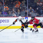 
              Philadelphia Flyers' Ivan Provorov, left, chases after the puck against Chicago Blackhawks' Colin Blackwell during the third period of an NHL hockey game, Thursday, Jan. 19, 2023, in Philadelphia. (AP Photo/Matt Slocum)
            