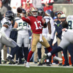 
              San Francisco 49ers' Brock Purdy passes against Seattle Seahawks during the second quarter of an NFC wild-card NFL football playoff game in Santa Clara, Calif., Saturday, Jan. 14, 2023. (Scott Strazzante/San Francisco Chronicle via AP)
            