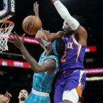 
              Phoenix Suns forward Josh Okogie (2) blocks the shot of Charlotte Hornets forward Jalen McDaniels during the first half of an NBA basketball game, Tuesday, Jan. 24, 2023, in Phoenix. (AP Photo/Matt York)
            