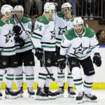 
              Dallas Stars center Tyler Seguin (91) skates back to the bench as teammates celebrate his goal during the second period of an NHL hockey game against the New York Rangers on Thursday, Jan. 12, 2023, in New York. (AP Photo/Adam Hunger)
            