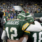 
              Green Bay Packers quarterback Aaron Rodgers (12) gets a hug from teammate Randall Cobb as the head off the field following an NFL football game against the Detroit Lions Sunday, Jan. 8, 2023, in Green Bay, Wis. The Lions won 20-16. (AP Photo/Morry Gash)
            