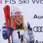 
              United States' Mikaela Shiffrin is overcome by emotion as she stands on the podium after winning an alpine ski, women's World Cup giant slalom race, in Kranjska Gora, Slovenia, Sunday, Jan. 8, 2023. Shiffrin matched Lindsey Vonn's women's World Cup skiing record with her 82nd win Sunday. (AP Photo/Giovanni Auletta)
            