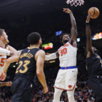 
              New York Knicks forward Julius Randle (30) and Toronto Raptors forward Pascal Siakam (43) reach for a rebound during the second half of an NBA basketball game Friday, Jan. 6, 2023, in Toronto. (Cole Burston/The Canadian Press via AP)
            