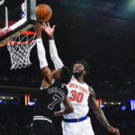 
              New York Knicks' Julius Randle (30) blocks a shot by San Antonio Spurs' Josh Richardson (7) during the first half of an NBA basketball game Wednesday, Jan. 4, 2023, in New York. (AP Photo/Frank Franklin II)
            