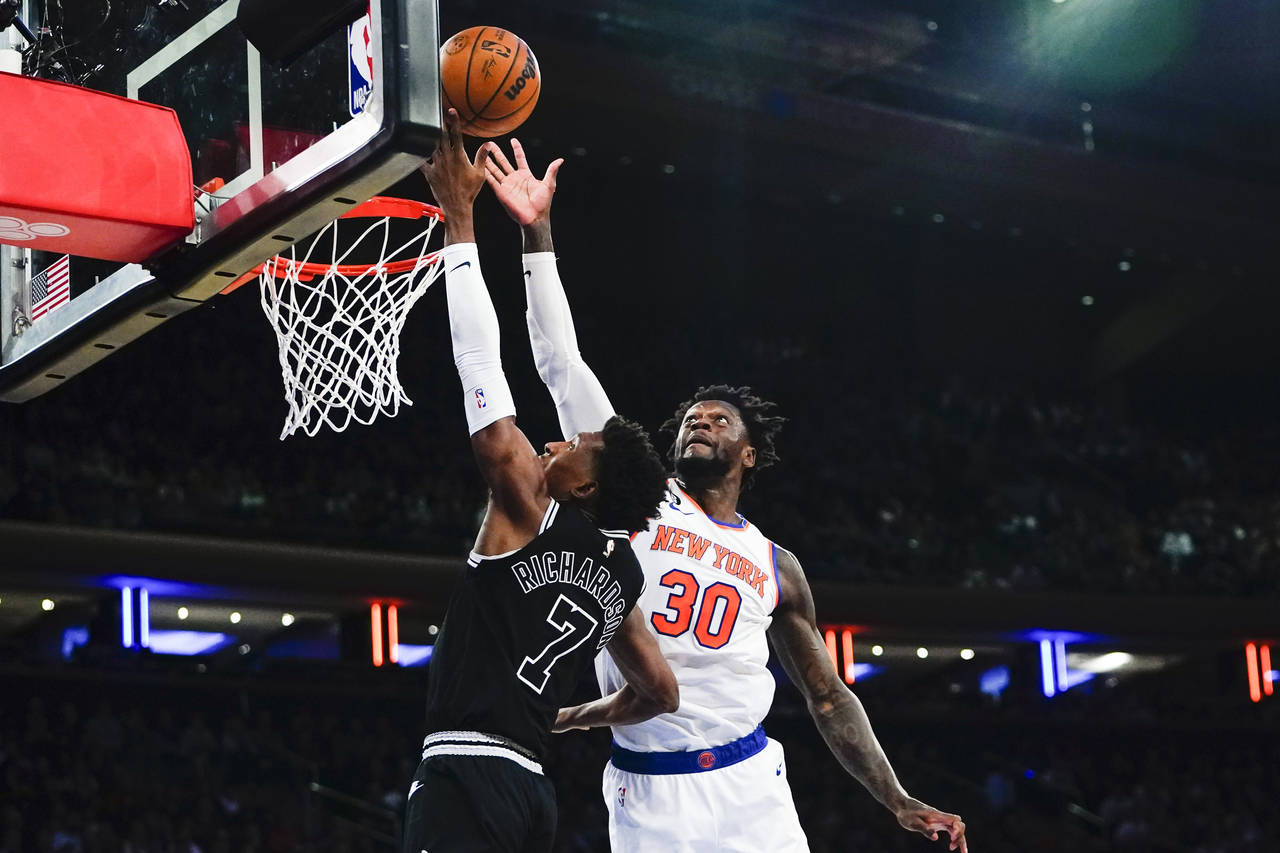 New York Knicks' Julius Randle (30) blocks a shot by San Antonio Spurs' Josh Richardson (7) during ...