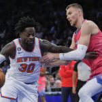 
              New York Knicks forward Julius Randle (30) drives against Washington Wizards center Kristaps Porzingis during the first half of an NBA basketball game Wednesday, Jan. 18, 2023, at Madison Square Garden in New York. (AP Photo/Mary Altaffer)
            
