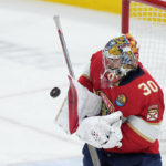 
              Florida Panthers goaltender Spencer Knight blocks a shot during the third period of an NHL hockey game against the Arizona Coyotes, Tuesday, Jan. 3, 2023, in Sunrise, Fla. (AP Photo/Wilfredo Lee)
            