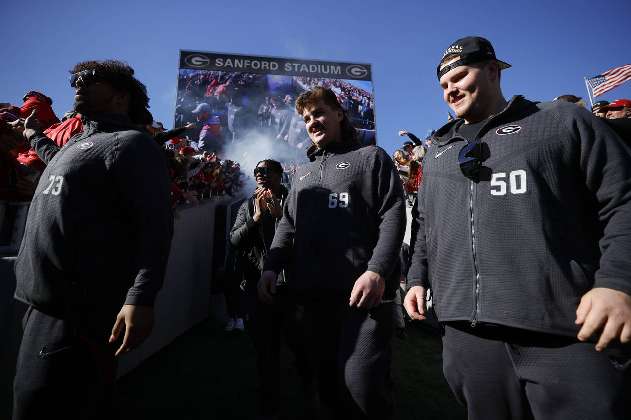 Georgia players take the field during a ceremony celebrating the Bulldog's second consecutive NCAA ...