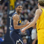 
              Denver Nuggets forward Bruce Brown, left, reacts after he was called for a foul, next to Indiana Pacers guard Chris Duarte during the second half of an NBA basketball game Friday, Jan. 20, 2023, in Denver. (AP Photo/David Zalubowski)
            