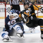 
              Pittsburgh Penguins' Bryan Rust, right, and Winnipeg Jets' Brenden Dillon collide during the second period of an NHL hockey game in Pittsburgh, Friday, Jan. 13, 2023. (AP Photo/Gene J. Puskar)
            