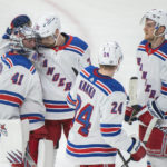 
              New York Rangers goaltender Jaroslav Halak (41) is congratulated by teammates after defeating the Montreal Canadiens in an NHL hockey game in Montreal, Thursday, Jan. 5, 2023. (Graham Hughes/The Canadian Press via AP)
            