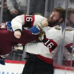 
              Ottawa Senators left wing Austin Watson, right, dodges a punch from Colorado Avalanche defenseman Andreas Englund during the second period of an NHL hockey game Saturday, Jan. 14, 2023, in Denver. (AP Photo/David Zalubowski)
            