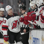
              New Jersey Devils left wing Jesper Bratt (63) is greeted by teammates after scoring during the first period of an NHL hockey game against the Anaheim Ducks in Anaheim, Calif., Friday, Jan. 13, 2023. (AP Photo/Ashley Landis)
            