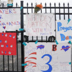 
              Signs sit along a fence outside UC Medical Center where Buffalo Bills safety Damar Hamiln remains hospitalized, Thursday, Jan. 5, 2023, in Cincinnati. Damar Hamlin has shown what physicians treating him are calling “remarkable improvement over the past 24 hours,” the team announced in a statement on Thursday, three days after the player went into cardiac arrest and had to be resuscitated on the field. (AP Photo/Joshua A. Bickel)
            