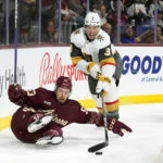 
              Vegas Golden Knights defenseman Brayden McNabb (3) gets the puck from Arizona Coyotes left wing Michael Carcone during the first period of an NHL hockey game in Tempe, Ariz., Sunday, Jan. 22, 2023. (AP Photo/Ross D. Franklin)
            