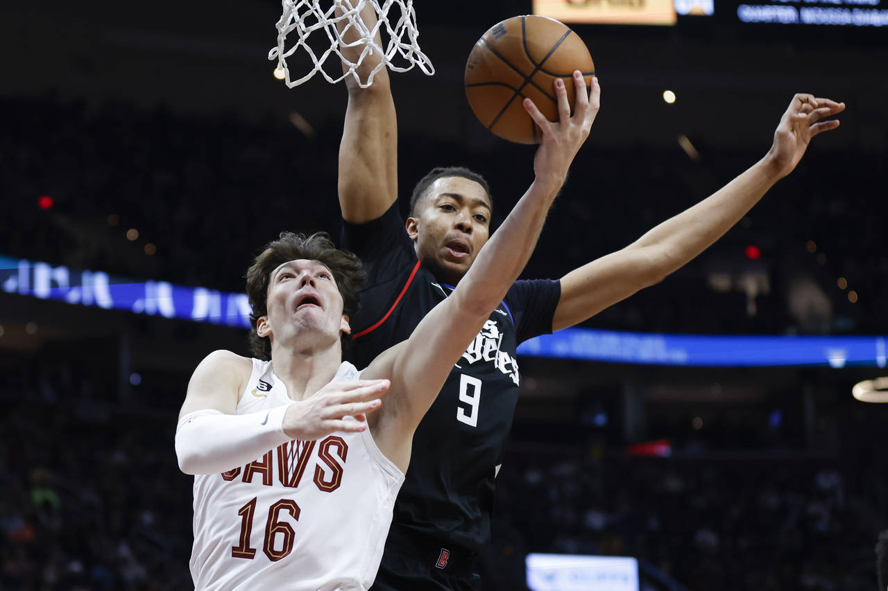 Cleveland Cavaliers forward Cedi Osman (16) shoots against Los Angeles Clippers center Moses Brown ...