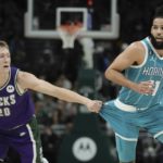 
              Milwaukee Bucks' AJ Green tries to stop Charlotte Hornets' Cody Martin during the first half of an NBA basketball game Friday, Jan. 6, 2023, in Milwaukee. (AP Photo/Morry Gash)
            