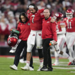 
              Utah quarterback Cameron Rising (7) is helped off the field during the second half in the Rose Bowl NCAA college football game against Penn State Monday, Jan. 2, 2023, in Pasadena, Calif. (AP Photo/Marcio Jose Sanchez)
            