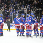 
              New York Rangers goaltender Igor Shesterkin (31) celebrates with teammates after an NHL hockey game against the Florida Panthers, Monday, Jan. 23, 2023, in New York. (AP Photo/Frank Franklin II)
            