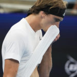 
              Germany's Alexander Zverev wipes the sweat from his face during his games against United States' Taylor Fritz during their Group C match at the United Cup tennis event in Sydney, Australia, Monday, Jan. 2, 2023. (AP Photo/Mark Baker)
            