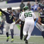 
              Seattle Seahawks quarterback Geno Smith (7) showers against the New York Jets during the first half of an NFL football game, Sunday, Jan. 1, 2023, in Seattle. (AP Photo/Godofredo A. Vásquez)
            