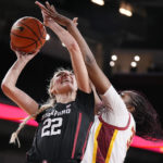 
              Stanford forward Cameron Brink, left, shoots as Southern California center Clarice Akunwafo defends during the first half of an NCAA college basketball game Sunday, Jan. 15, 2023, in Los Angeles. (AP Photo/Mark J. Terrill)
            