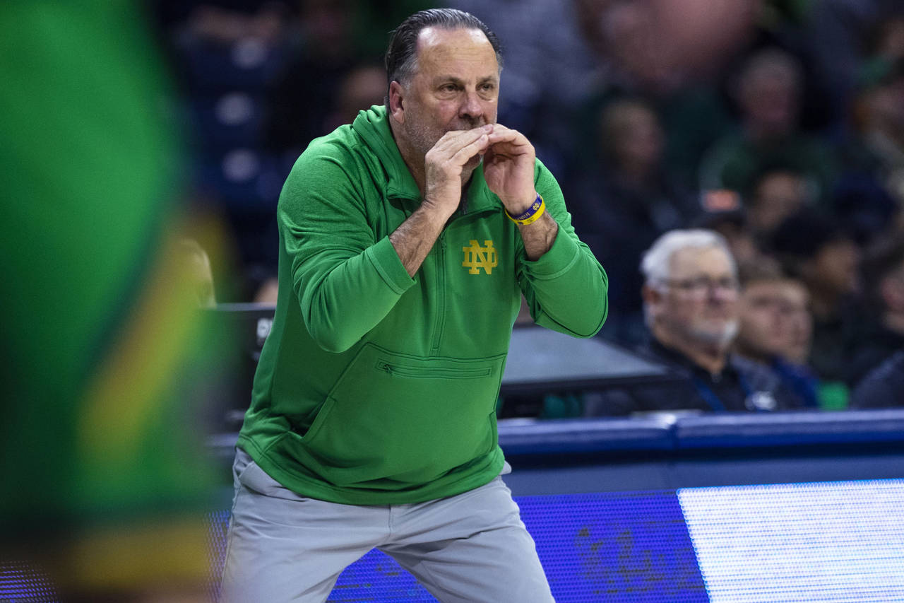 Notre Dame coach Mike Brey shouts during the first half of the team's NCAA college basketball game ...
