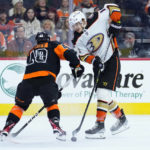 
              Anaheim Ducks' Troy Terry, right, tries to get past Philadelphia Flyers' Morgan Frost during the first period of an NHL hockey game, Tuesday, Jan. 17, 2023, in Philadelphia. (AP Photo/Matt Slocum)
            