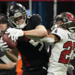 
              Atlanta Falcons wide receiver Drake London (5) makes a catch against Tampa Bay Buccaneers cornerback Zyon McCollum (27) during the second half of an NFL football game, Sunday, Jan. 8, 2023, in Atlanta. (AP Photo/John Bazemore)
            