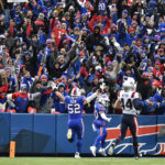 
              Buffalo Bills running back Nyheim Hines (20) celebrates after running in a touchdown on a punt return during the second half of an NFL football game against the New England Patriots, Sunday, Jan. 8, 2023, in Orchard Park. (AP Photo/Adrian Kraus)
            
