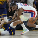 
              Golden State Warriors guard Jordan Poole (3) loses the ball while being defended by Detroit Pistons guard Alec Burks during the second half of an NBA basketball game in San Francisco, Wednesday, Jan. 4, 2023. (AP Photo/Jeff Chiu)
            