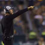 
              FILE - Philadelphia Eagles linebackers coach Nick Rallis gestures during a preseason NFL football game against the Pittsburgh Steelers, Thursday, Aug. 12, 2021, in Philadelphia. It's a big weekend for Nick Rallis and big brother Mike. Mike Rallis, better known as WWE star Madcap Moss, is in the mix for Saturday's Royal Rumble. (AP Photo/Rich Schultz, File)
            